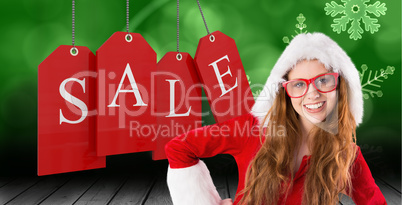 Composite image of festive redhead smiling at camera