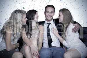 Composite image of girls flirting with young man
