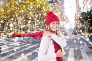 Composite image of happy blonde in winter clothes