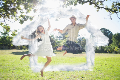 Composite image of cute couple jumping in the park together