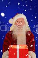 Composite image of father christmas offering a magical christmas