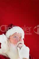 Composite image of santa is thinking about something