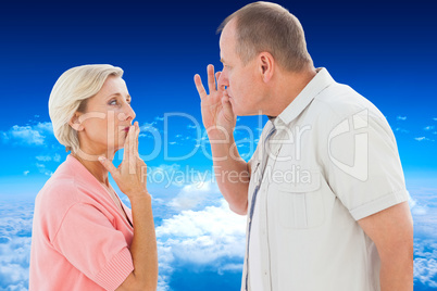 Composite image of older couple holding hands to mouth for silen