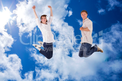 Composite image of couple jumping in the air