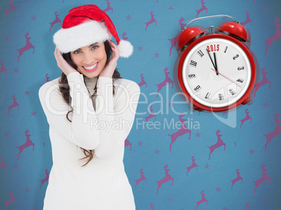 Composite image of festive brunette smiling at camera