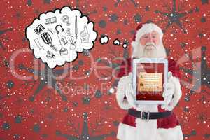 Composite image of santa presents a tablet pc