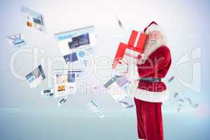 Composite image of santa carries a few presents