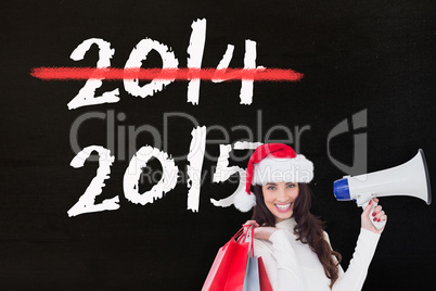 Composite image of smiling brunette holding gift bags and megaph