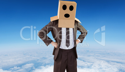 Composite image of anonymous businessman with hands on hips