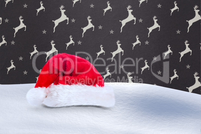 Composite image of santa hat on snow