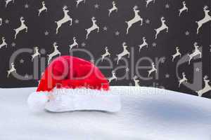 Composite image of santa hat on snow