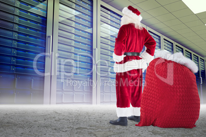 Composite image of happy santa with sack of gifts