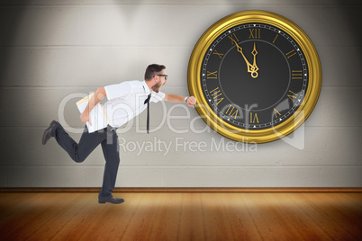 Composite image of geeky young businessman running late