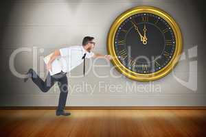 Composite image of geeky young businessman running late