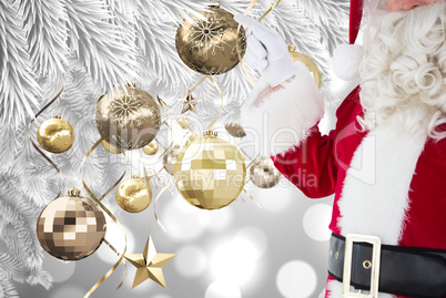 Composite image of mid section of santa pointing