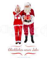 Composite image of santa and mrs claus smiling at camera offerin