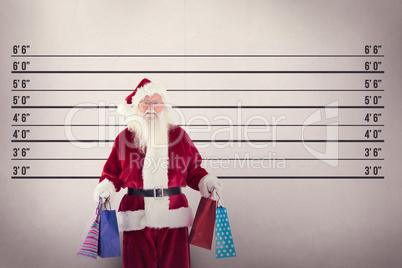 Composite image of santa carries some christmas bags