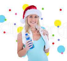 Composite image of festive fit blonde smiling at camera