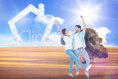 Composite image of happy casual couple cheering together