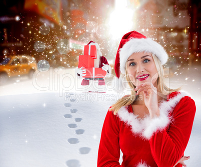 Composite image of festive blonde smiling at camera