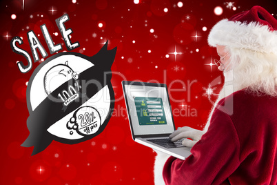 Composite image of santa claus uses a laptop