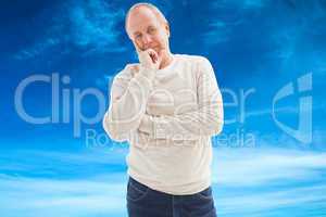 Composite image of thinking mature man with hand on chin
