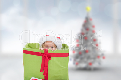 Composite image of cute girl in large gift