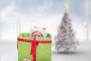 Composite image of cute girl in large gift