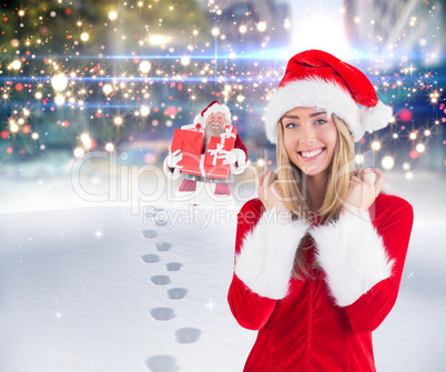 Composite image of pretty santa girl smiling at camera