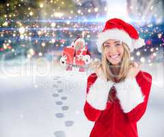 Composite image of pretty santa girl smiling at camera