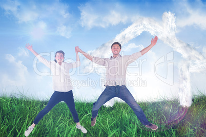 Composite image of couple jumping and holding hands