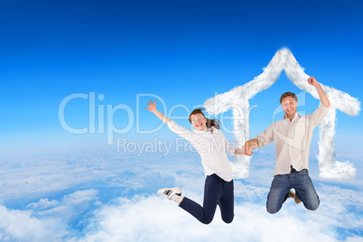 Composite image of couple jumping and holding hands