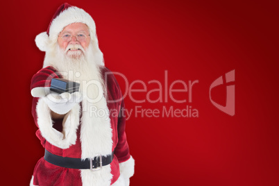 Composite image of santa shows a little box