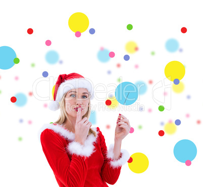 Composite image of festive blonde keeping a secret