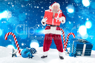 Composite image of santa carries a few presents