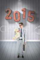 Composite image of businessman holding teddy bear