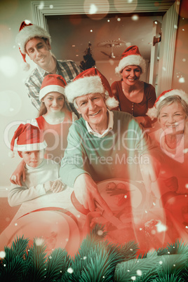 Composite image of grandfather in santa hat carving chicken at c