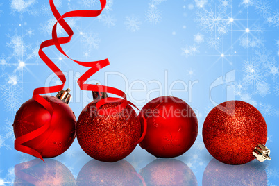 Composite image of four red christmas ball decorations