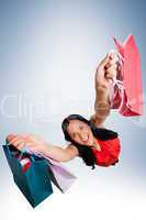 Woman standing with shopping bags