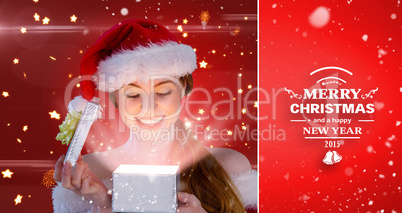 Composite image of sexy girl in santa costume opening a gift