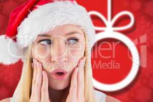 Composite image of festive blonde looking surprised with hands o