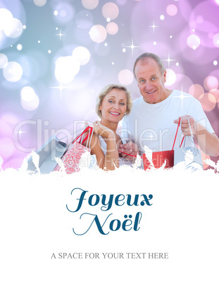 Composite image of couple with shopping bags