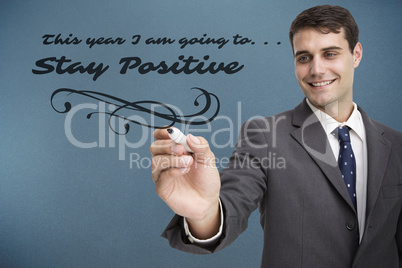 Composite image of young businessman writing something