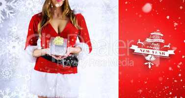Composite image of sexy santa girl holding gift