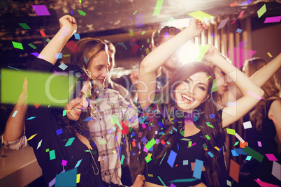 Composite image of stylish friends dancing and smiling