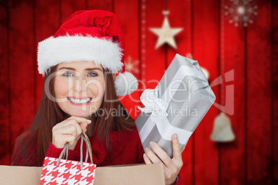 Composite image of woman with gifts