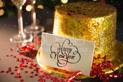 Happy new year card on table set for party