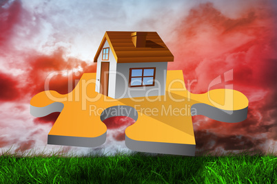 Composite image of house on jigsaw piece