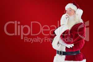 Composite image of santa is thinking about something