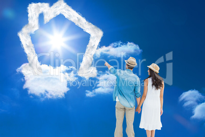 Composite image of happy hipster couple holding hands and lookin